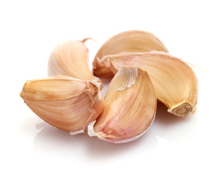 Garlic cloves isolated on white background