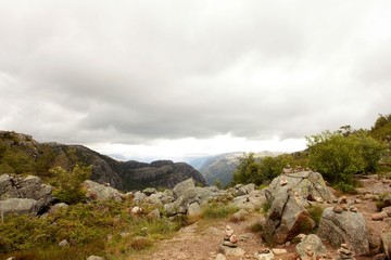 Preikestolen the Pulpit Rock, most famous tourist attraction in Ryfylke, towers an impressive 604 metres over the Lysefjord. Cliff in Norway - nature and travel background