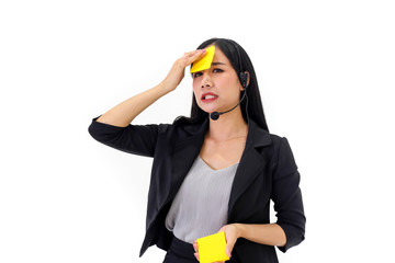 Beautiful asian woman Serious call center operator in wireless headset talking with customer,in customer support service.