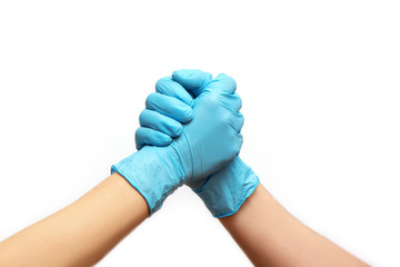Hands of friends in medical gloves greeting each other.