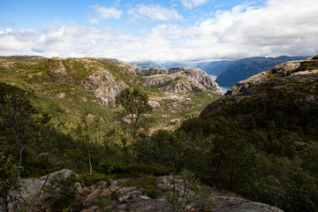 blue sky in the mountain forests. Trip to the Pulpit rock in Norway.