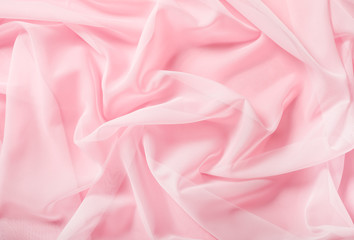 Tender pink silk draped fabric background