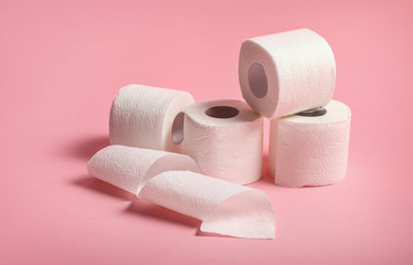 Toilet paper rolls on pink background