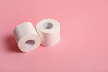 Toilet paper rolls on pink background