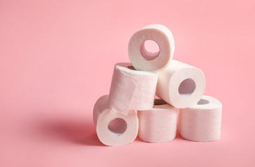 Toilet paper rolls on pink background