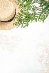 Light textured background with a green twig