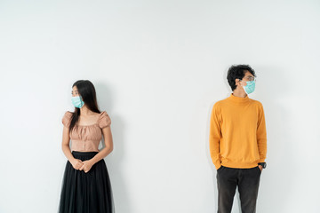 social distancing. people with masks keep their distance during virus symptoms