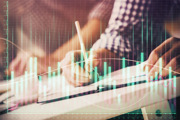 Multi exposure of two men planing investment with stock market forex chart.