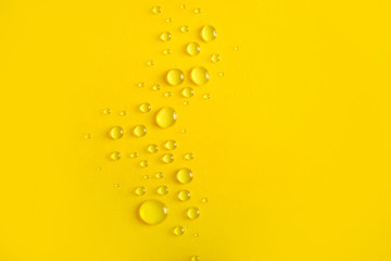 Water drops on yellow background