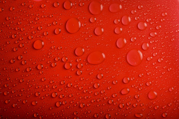 Water drops on red background