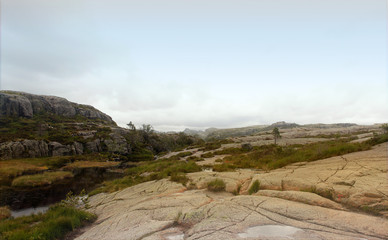 Road to the Cliff Preikestolen in fjord Lysefjord - Norway - nature and travel background. Vacation concept.
