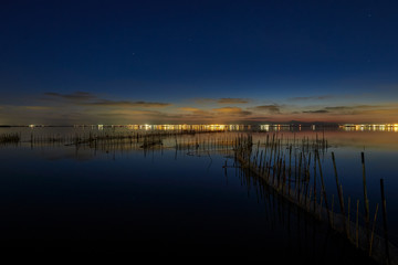 Obraz premium Last lights of the day in the lagoon of Valencia, Spain