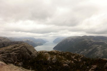 View from the Cliff Preikestolen in fjord Lysefjord - Norway - nature and travel background. Vacation concept. Granite rocks and mountains