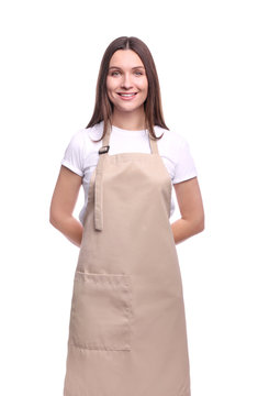 Young woman in apron isolated on white background