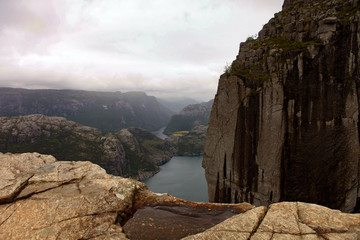 View from the Cliff Preikestolen in fjord Lysefjord - Norway - nature and travel background. Vacation concept. Granite rocks and mountains