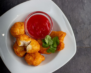 Crispy chicken nuggets with ketchup