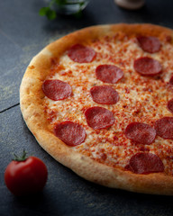 Tasty pepperoni pizza over a rustic background