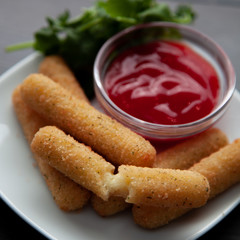 Delicious mozzarella/cheese sticks with ketchup