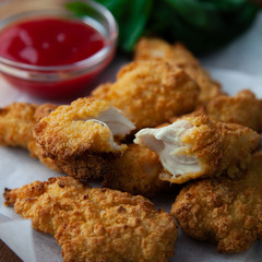 Crispy chicken strips with ketchup