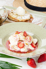 White ice cream with berry strawberries and syrup