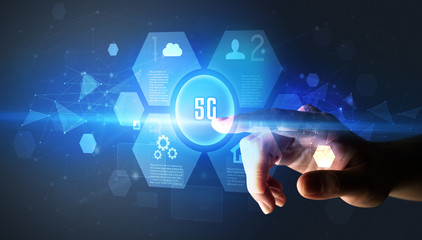 Hand touching 5G inscription, new technology concept