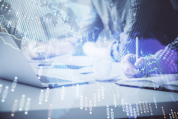 Multi exposure of forex chart with man working on computer on background. Concept of market analysis.