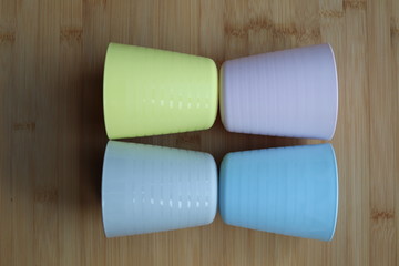 pale coloured plastic cup beakers