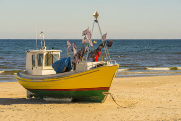 Naklejka na ściany i meble fishing boat sea day beach 