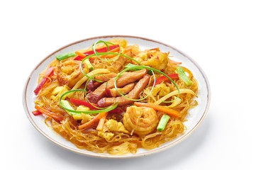 Singapore Mei Fun in plate isolated on white background. Singapore Noodles is chinese cuisine dish with rice noodles, prawns, char siu pork, carrot, red onion, napa cabbage. Chinese food.
