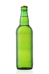 Bottle of beer covered by dew isolated on white