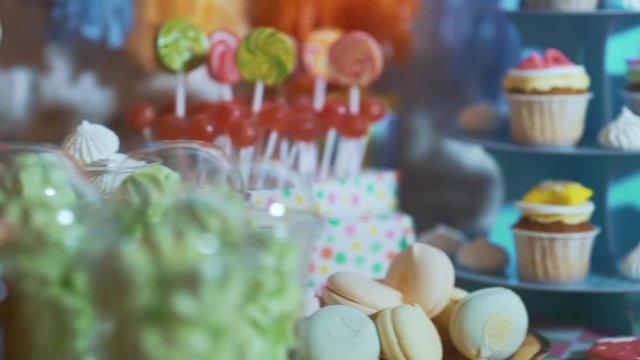 Beautiful candy bar with cakes and candies for birthday