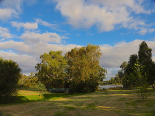 Fototapeta na wymiar Park in Broadmeadows Melbourne Victoria surrounded by green lush trees rivers and lakes