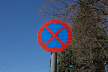 Road prohibition sign on the street against the sky