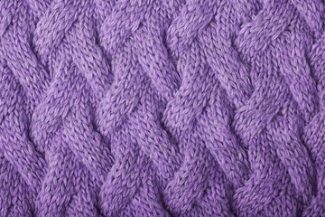 knitted carpet close -up. Textile texture on a white background. Detailed warm yarn background. Knit cashmere beige wool. Natural wool fabric, a fragment of a sweater.