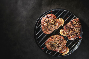 Meat with spice and herb on grill 