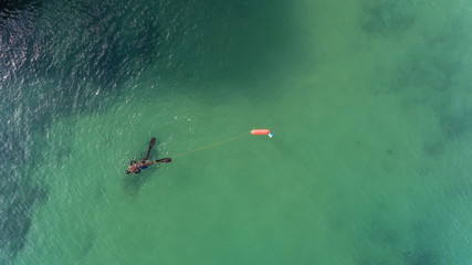 Underwater hunter on the surface of the water while hunting on the Atlantic Sea. Portugal. © Sergo