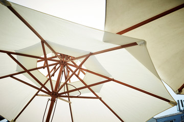 White parasols at cafe terrace  - obrazy, fototapety, plakaty