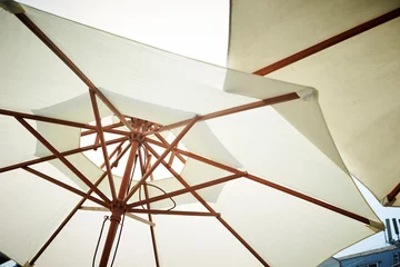 Foto op Canvas White parasols at cafe terrace  © mnimage