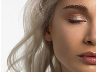 Fototapeta premium Closeup of half beauty woman with clean skin and natural cosmetics. Beautiful extrem eyelash and full lips of well-groomed girl demonstrate spa procedures, injections in a beauty parlor. Blonde hair