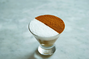 Latte art, half cream half cocoa powder 