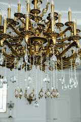 Chrystal chandelier lamp on the ceiling in Dining room Adjusting the image in a Luxury tone .Decorative elegant vintage and Contemporary interior Concept