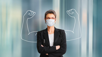 woman in medical face protection mask indoors on blue background
