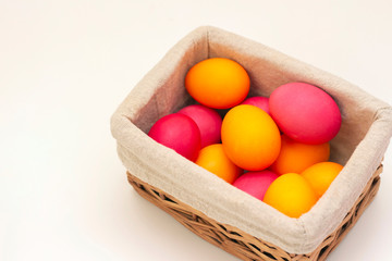 Easter eggs in the basket. Happy easter. painted eggs on a light background.
