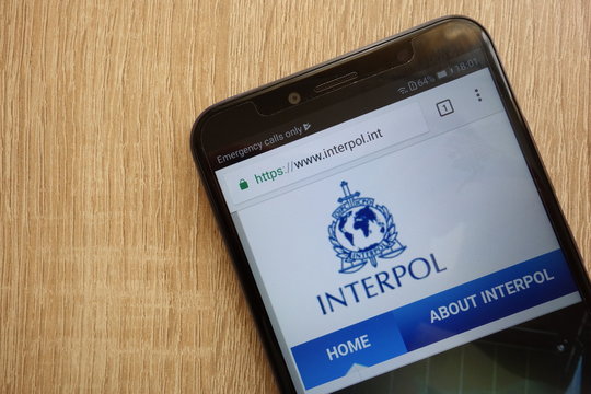 KONSKIE, POLAND - JULY 14, 2018: International Criminal Police Organization (Interpol) official website displayed on a modern smartphone