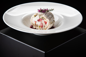 meringue roll with ice cream and strawberry slices