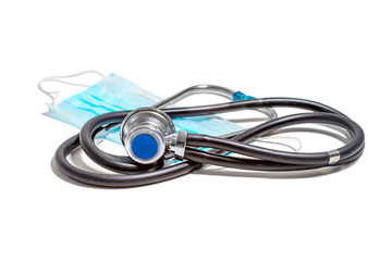Medical mask and stethoscope on an isolated white background