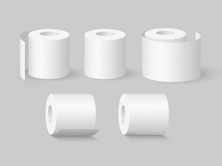 Set of realistic soft toilet paper rolls. Isolated on grey background. Vector illustration.