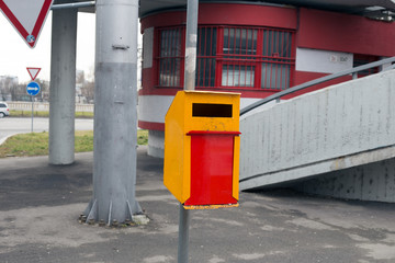 Yellow garbage bin on the street in Bratislava