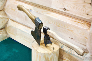 Axe and adze on wood