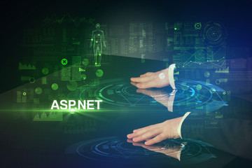 Businessman touching huge display with ASP.NET inscription, modern technology concept